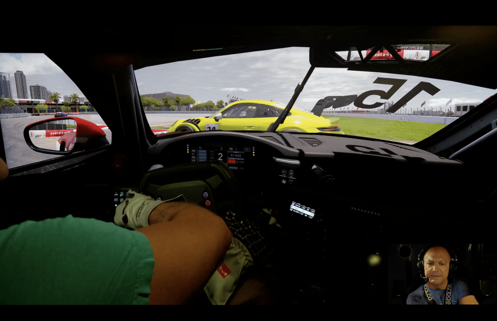 iRacing Porsche Cup cockpit view at St. Petersburg Grand Prix, chasing a yellow Porsche 911 Cup through a fast street section