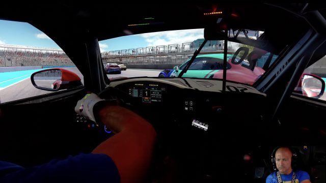 Porsche Cup Miami race start onboard, side by side with a pink and teal 911 Cup on the main straight